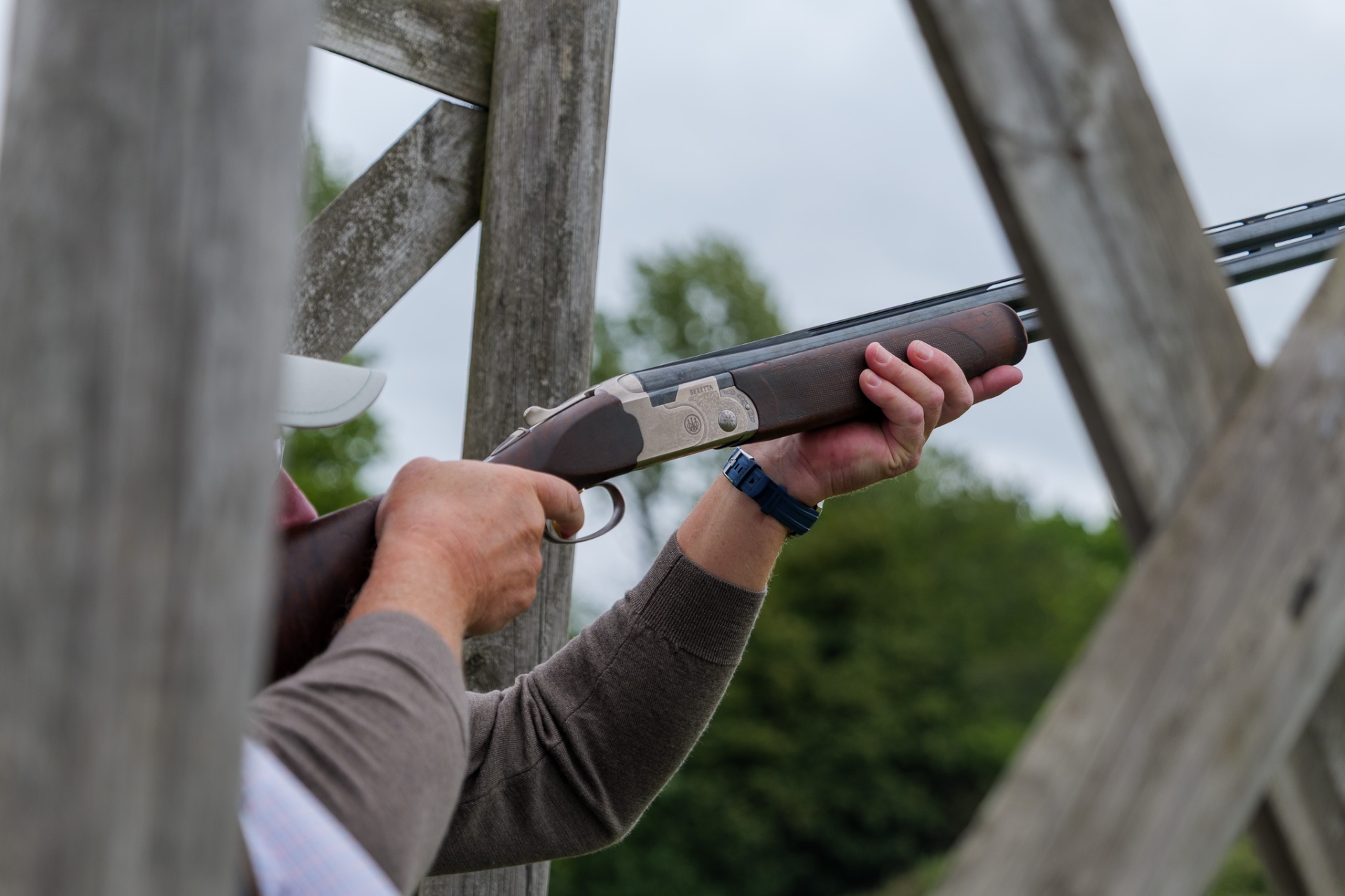 Beretta shotgun shouldered for a target