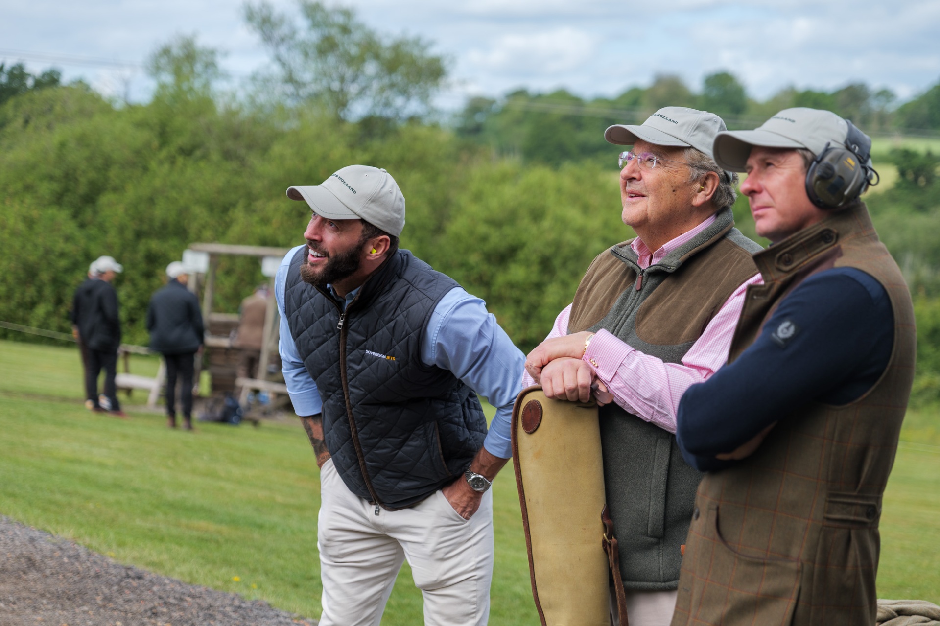 Three guests watching a clay